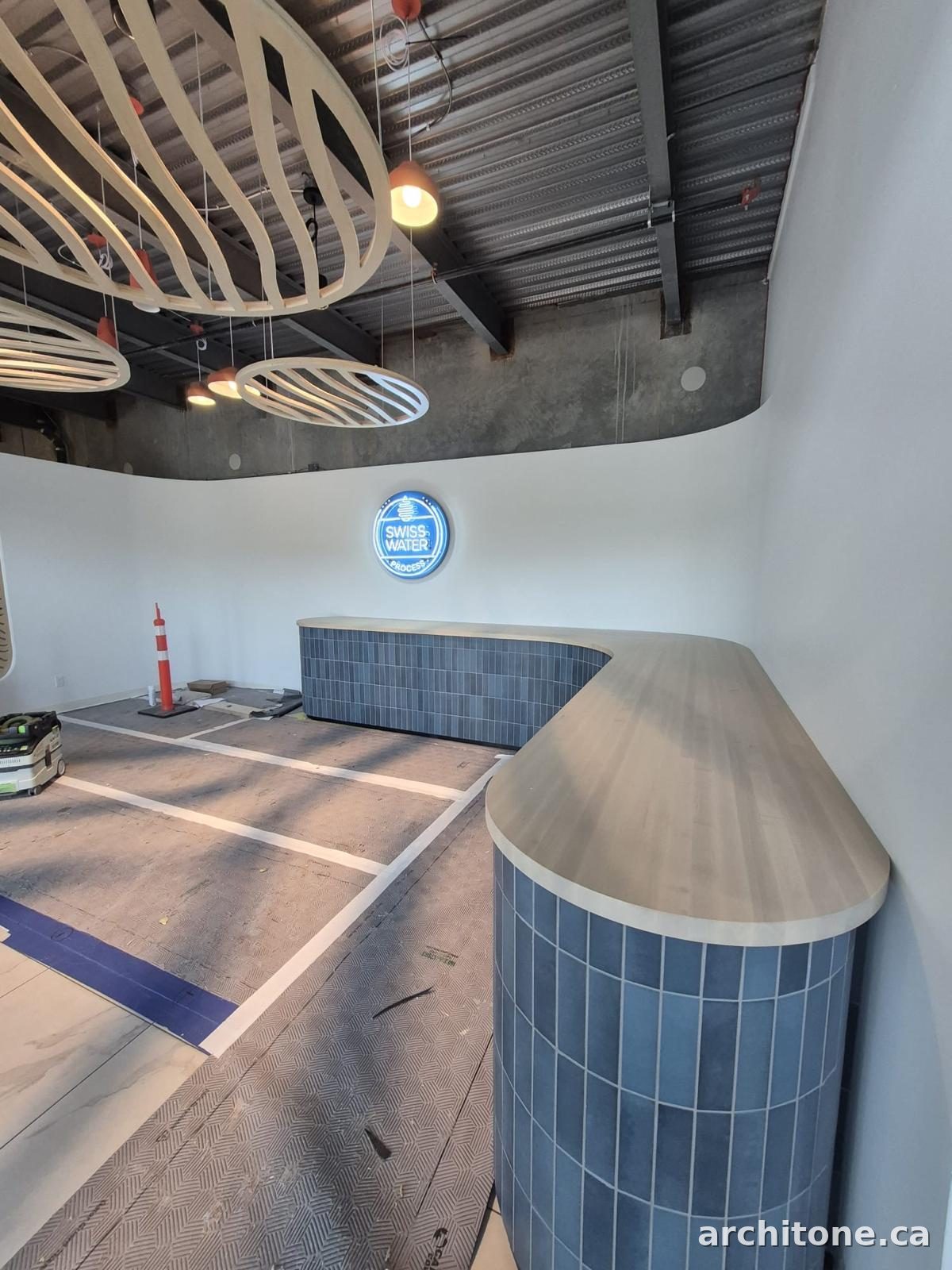 Sculptural timber ceiling and tiled counter renovation